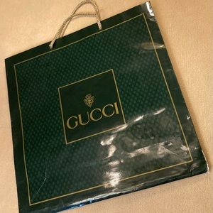 Gucci high gloss emerald green patterned paper , gold bordered logo